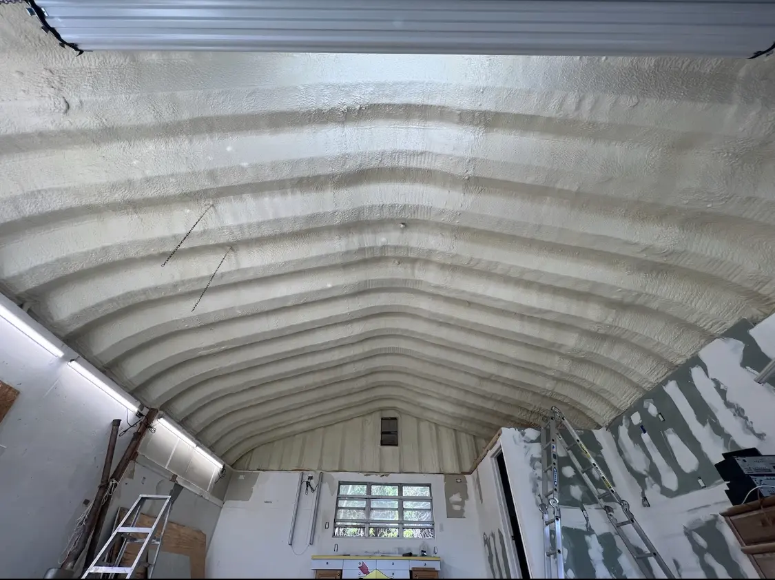 Spray polyurethane foam applied to the underside of a metal roof deck in Sky Lake